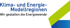 Logo der KEM (Klima- und Energie-Modellregionen) mit dem Slogan 'Wir gestalten die Energiewende'. Enthält blaue und grüne grafische Elemente.